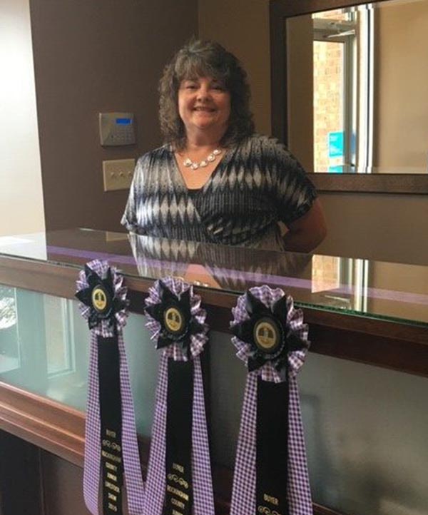 Blue Ridge Insurance Services - Milly Stanley Poses with Fair Ribbons 2019